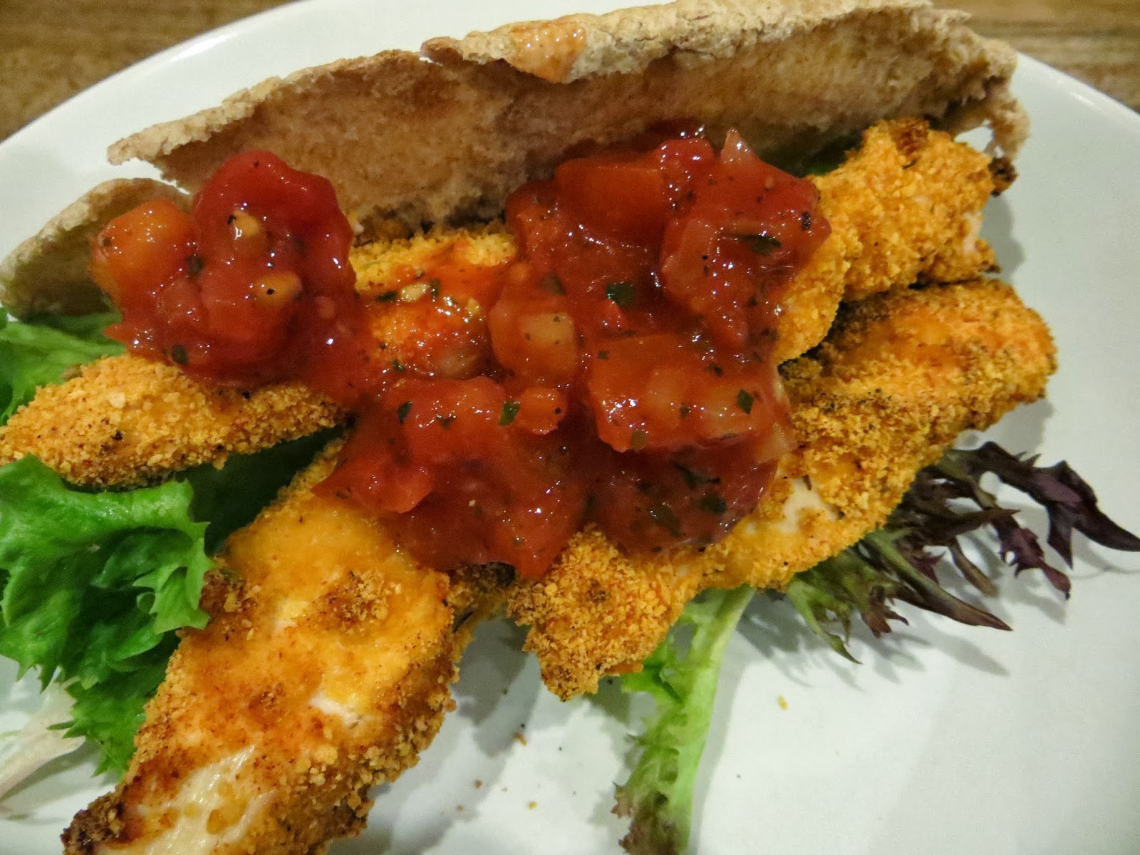 Chicken goujons with wholemeal pitta and tomato salsa