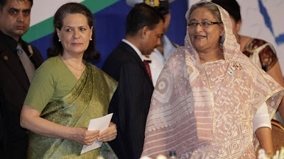 India`s Congress Party chief Sonia Gandhi and Bangladesh`s PM Sheikh Hasina look on during a conference on autism in Dhaka