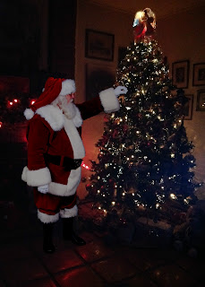 Santa hanging an ornament