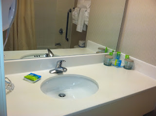 a bathroom sink with a mirror