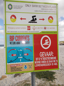 Warning and instructions for swimmers at "Camps Bay Beach".
