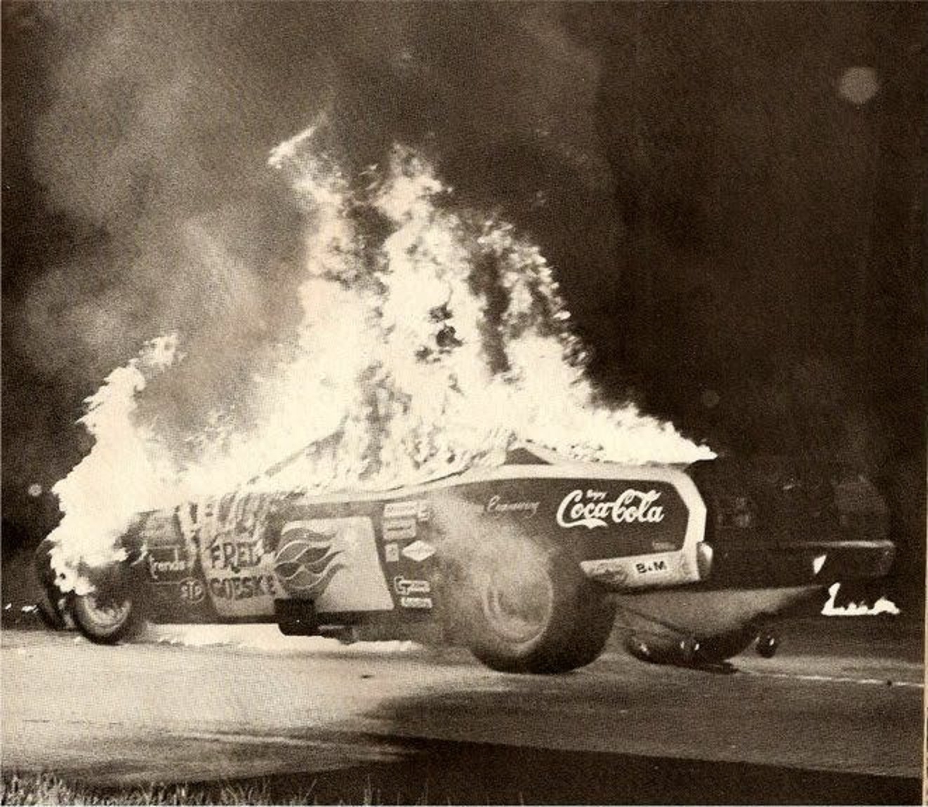A funny car burns on the track ~