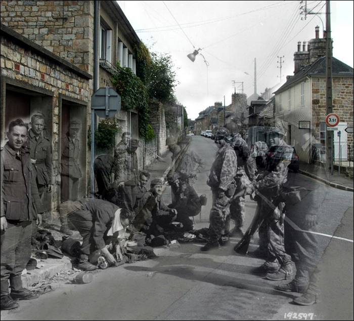 “France, 1944. Rue des Fossés Plissons à Domfront (Orne). German soldiers surrendering.”