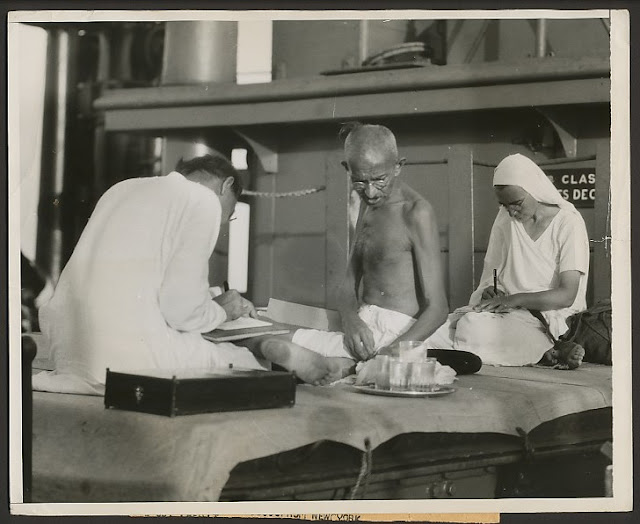 Mahatma+Gandhi+at+work+during+his+voyage+from+India+to+London+-+1931