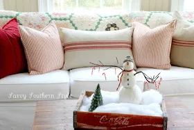 Snowman in a coke crate vignette, by Savvy Southern Style, featured on I Love That Junk. Check out this tour for the entire sunroom!