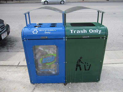 Blue and green side-by-side metal square cans with arced tops, one with a large opening at top and the other with four smaller holes