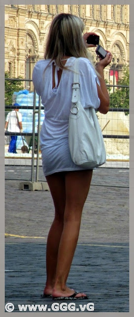 Blonde girl in white shirt on the street