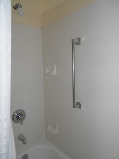 a bathroom with a grab bar