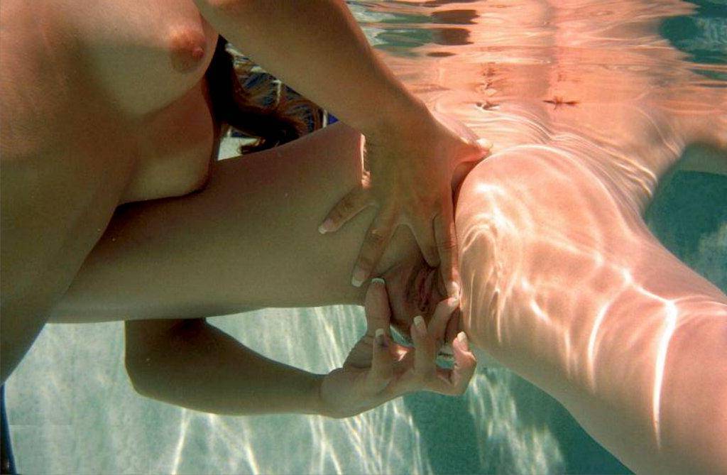 Nude couple in pool
