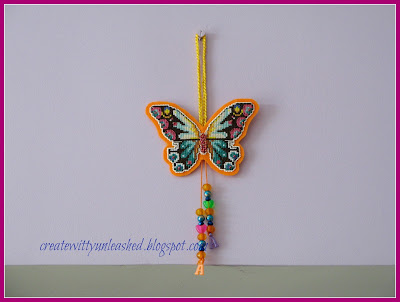 Cross stitched butterfly charm on plastic canvas 3