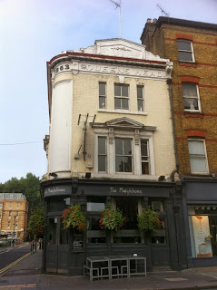 Ghost sign for the Queen's Head, Marylebone High Street, London