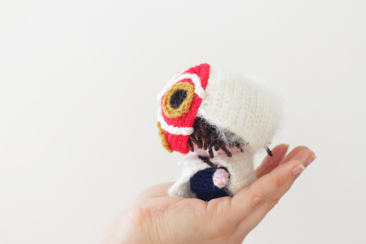 Amigurumi princess mononoke free pattern with mask shown from the side by The Sun and the Turtle