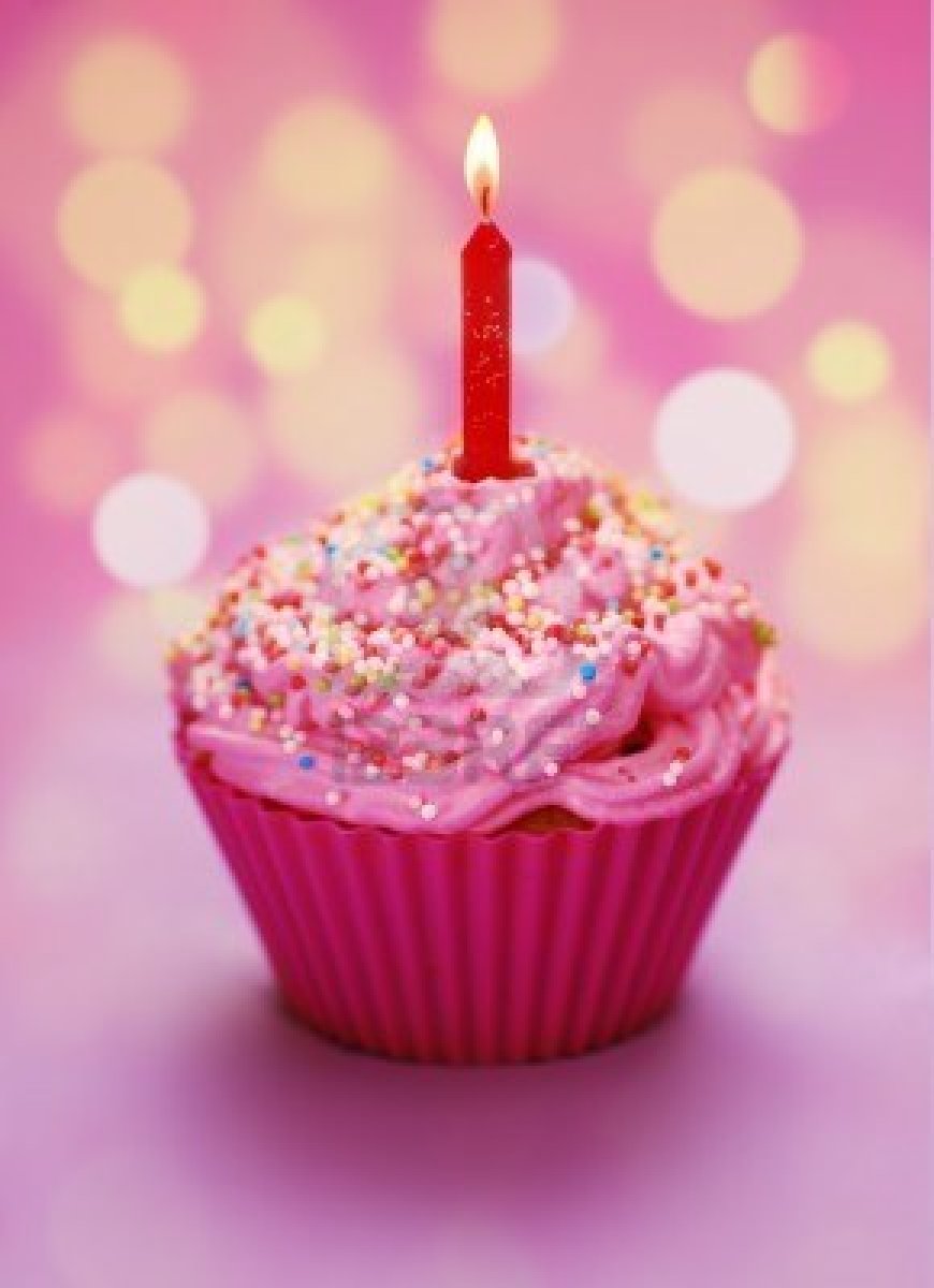 7977550 pink birthday cupcake with a candle