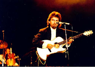 George Harrison, performing for The Prince's Trust charity, 1987 playing "Here Comes the Sun", Wembley Arena
