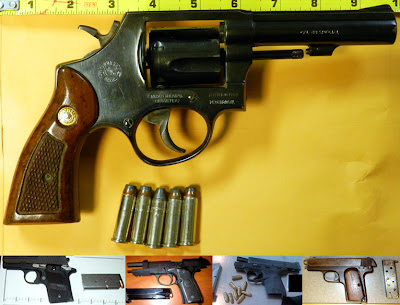 Loaded guns discovered in carry-on bags.