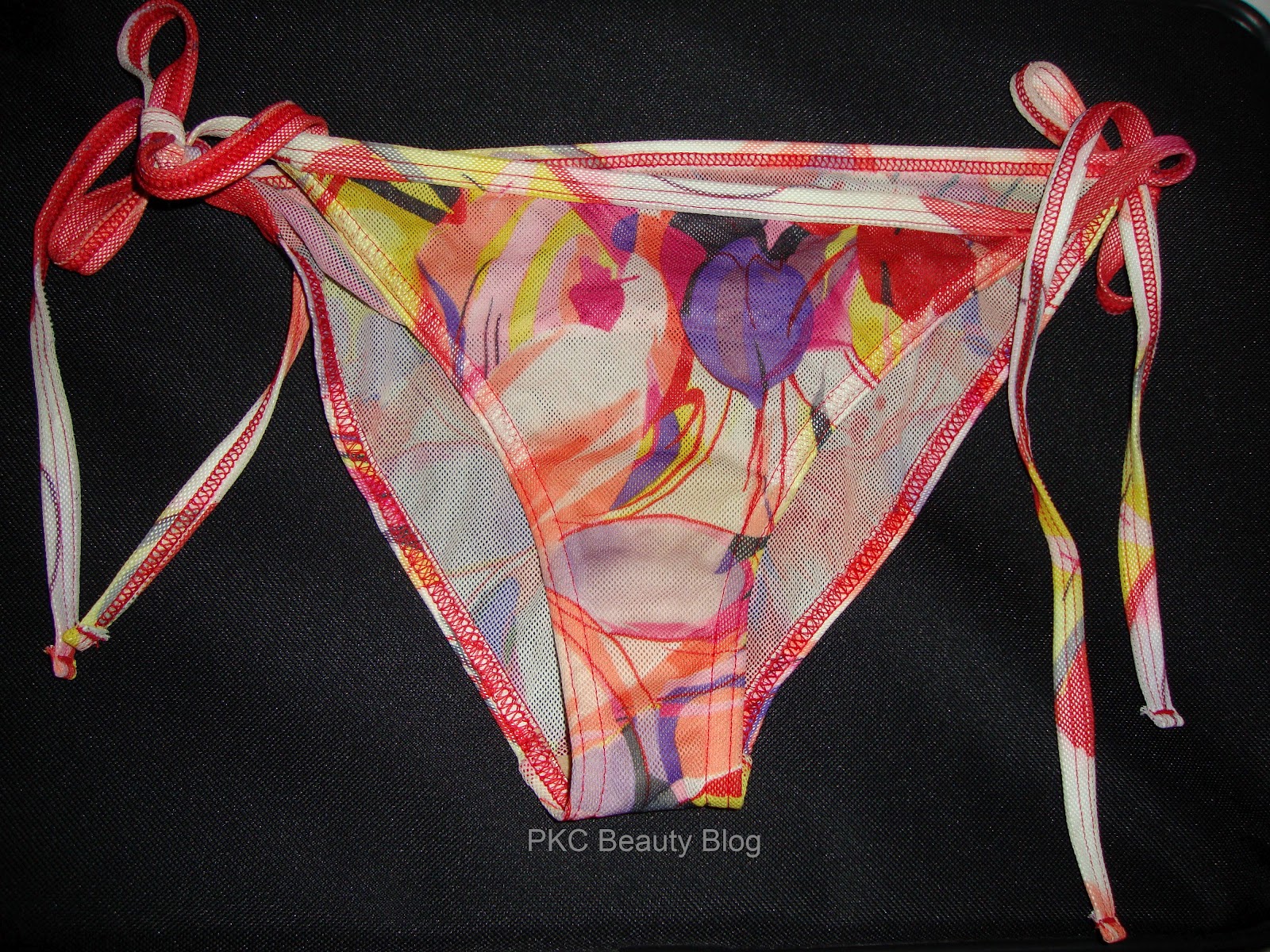 kiniki tan through swimwear