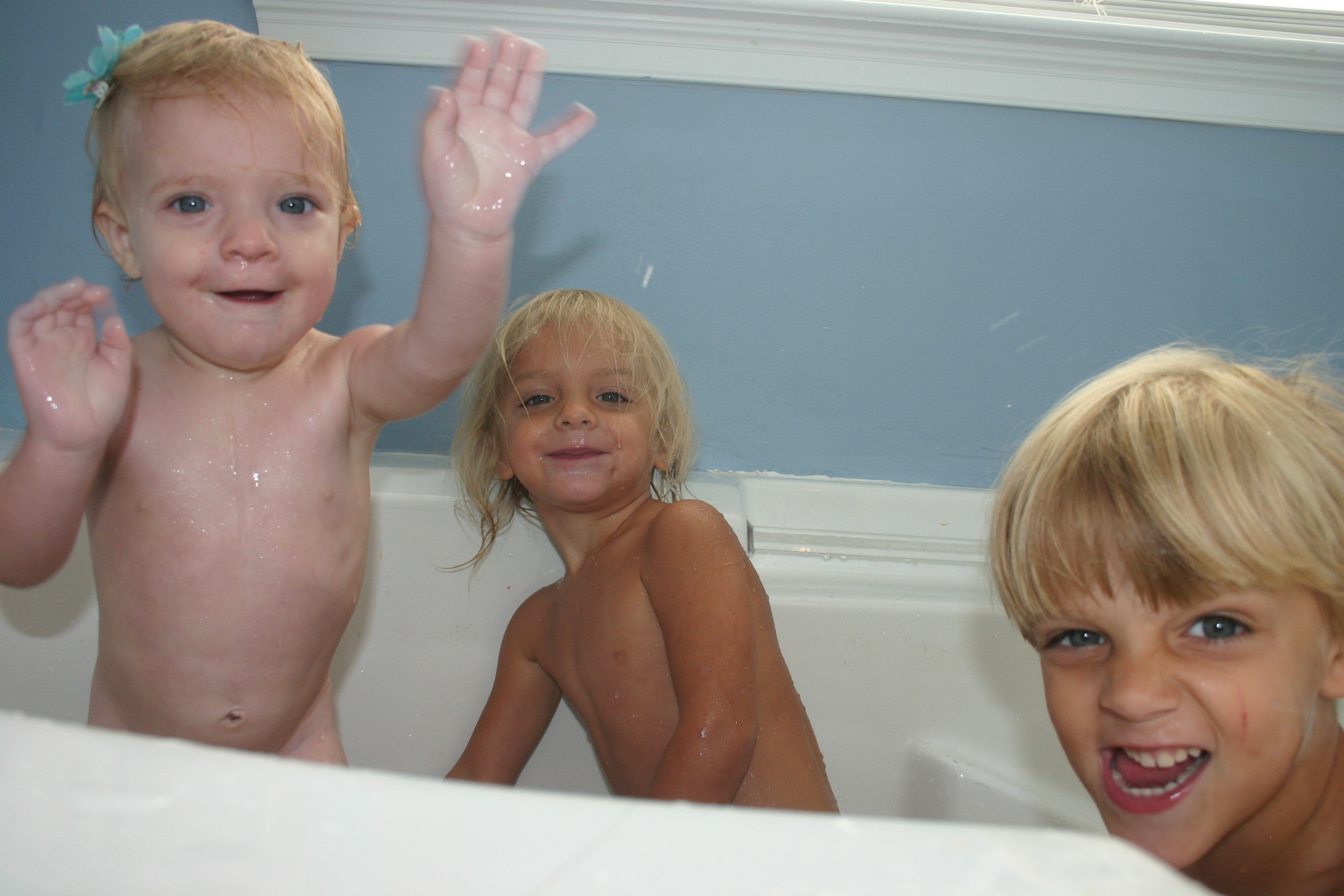 3 little monkeys taking a bubble bath.