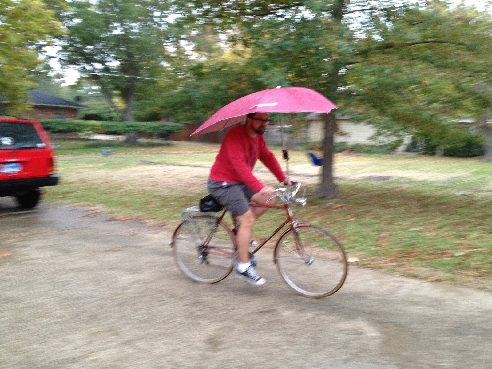 The Plano Cyclist Using The Uberhood Bicycle Umbrella In The Rain