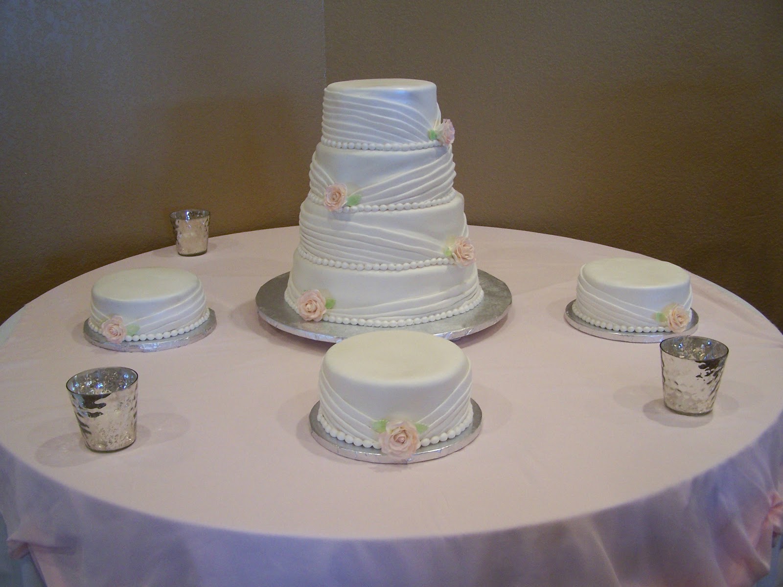traditional wedding cake purple Pleated wrapped wedding cake with matching side cakes,