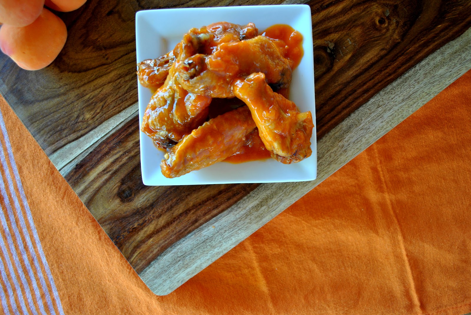 sweet and spicy apricotbuffalo chicken wings with bluecheese yogurt
