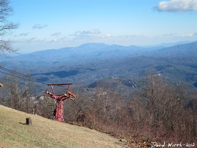 view of chair lift with smokey mountains in background