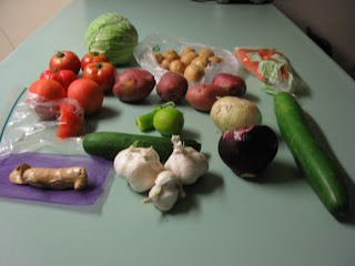 image of vegetables like tomatoes, potatoes, zuccini, cabbage garlic, ginger, onions,carrots also present