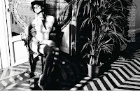 Penelope Cruz sitting on a chair in the living room