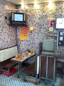 Interior of a miniature Hong Kong cafe.
