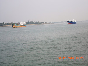 Large Ocean ships passing along the river on way to Kolkata Port.