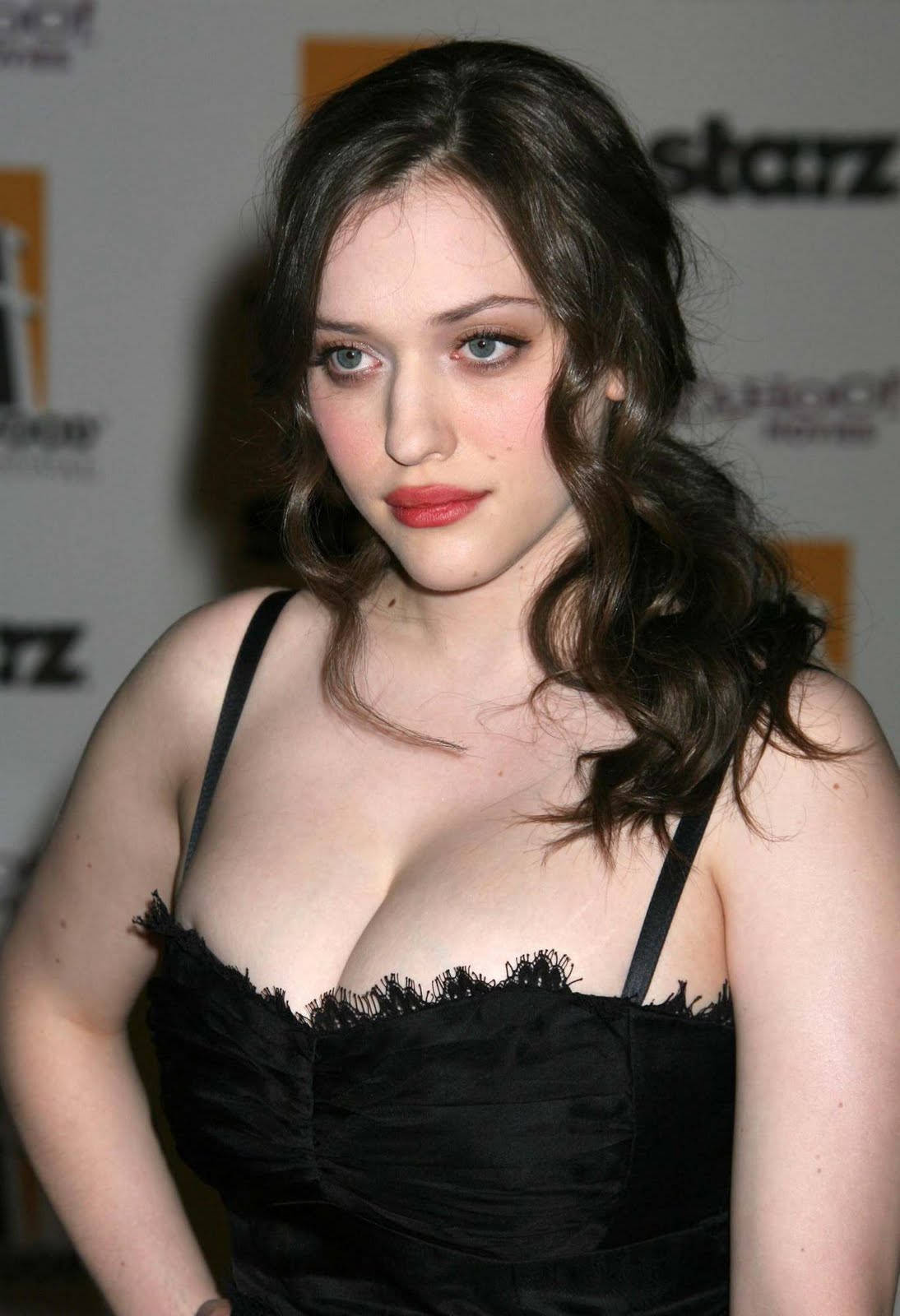 Kat Dennings in black.