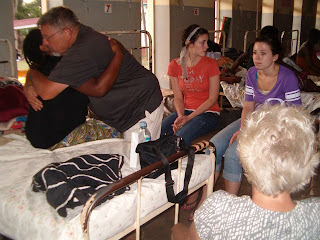 Lyzette Kasigwa is comforted by Paul Hunter and Pam Hunter Lyzette Kasigwa is comforted by Paul Hunter and Pam Hunter