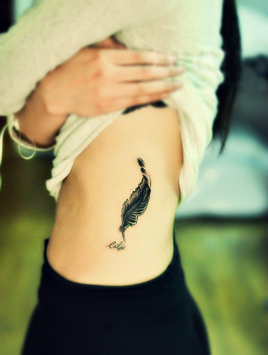 feather tattoo on the side