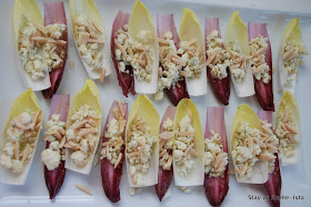 Beautiful platter, perfect for guests! Endive layered with cheese, nuts and honey.