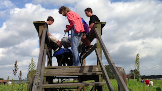 Melisa is getting Bo settled for a photo on the wooden tower. Melisa is getting Bo settled for a photo on the wooden tower.