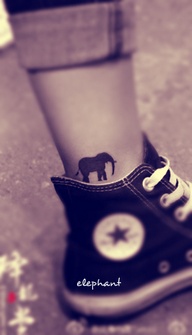 LITTLE CUTE AND BLACK ELEPHANT TATTOO ON ANKLE