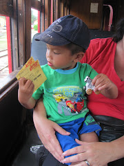 Alexandre holding out tickets for the train ride