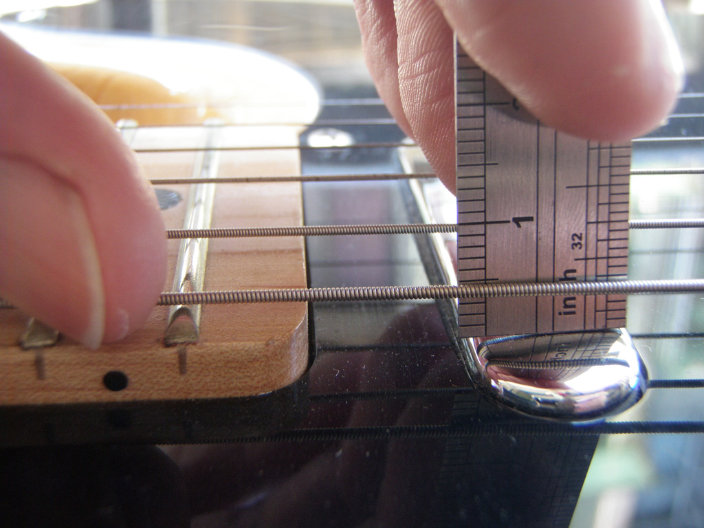 Adjusting the neck pickup height on a Fender Telecaster style guitar