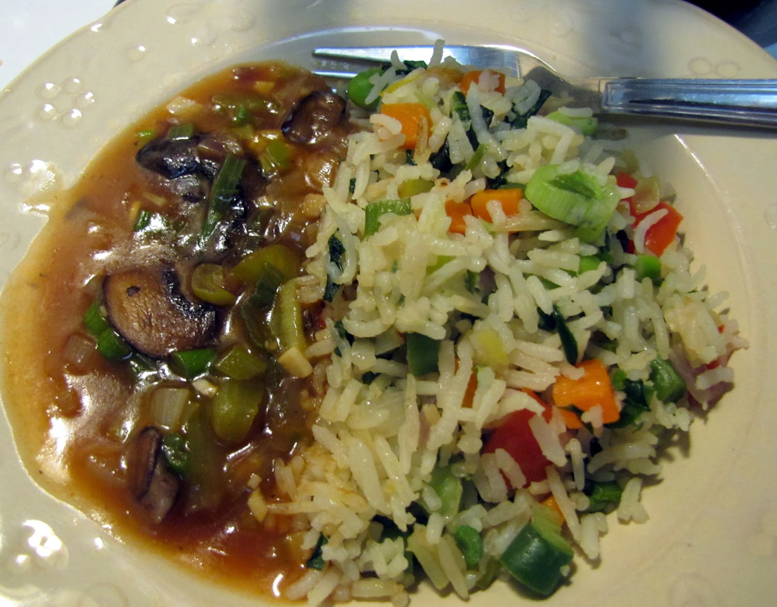 Indo Chinese Veggie fried rice and mushrooms in sweet and sour gravy