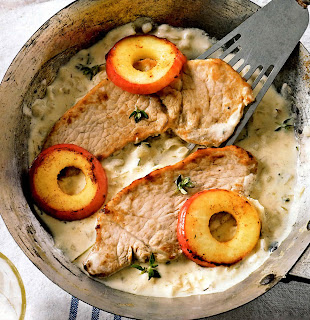 Pork escalopes served in a cider and cream sauce with apple rings.