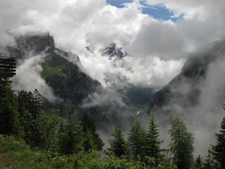Low clouds scattered across nearby peaks at the top of the Sunnbüel-bahn, Gemmipass, Switzerland