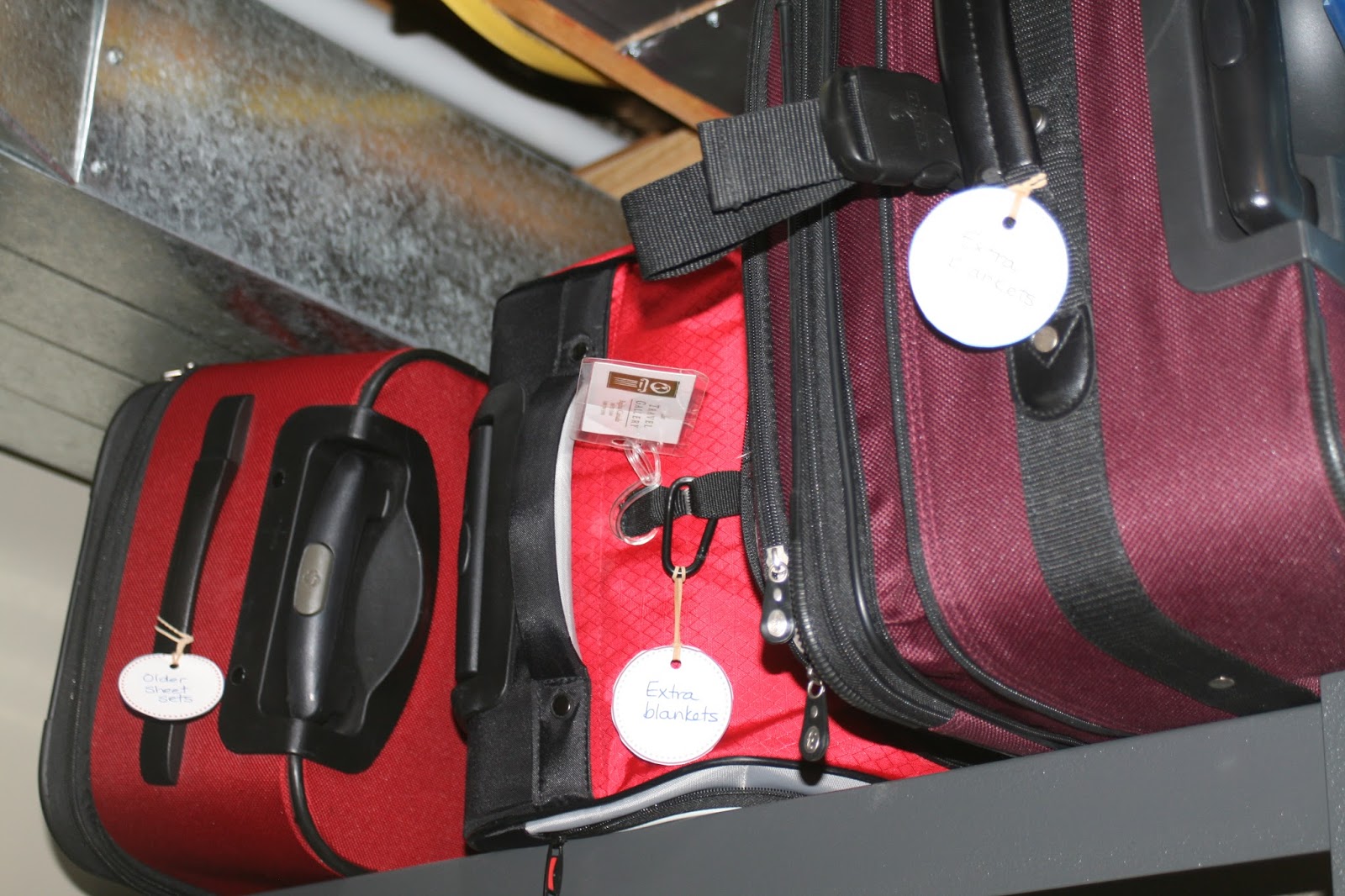 Organizing Our Family Home Using suitcases as storage