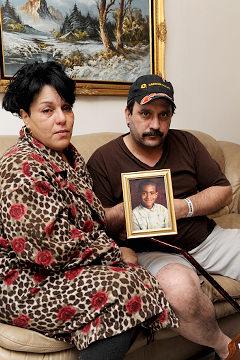 Relatives hold picture of Patrick