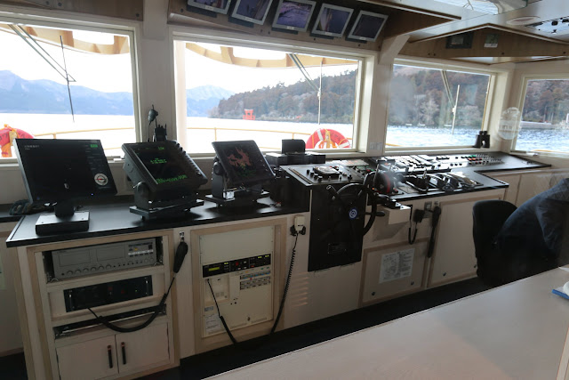 The view of the ship control deck room of the Hakone Cruise ship during cruising along Lake Ashinoko in Japan The view of the ship control deck room of the Hakone Cruise ship during cruising along Lake Ashinoko in Japan