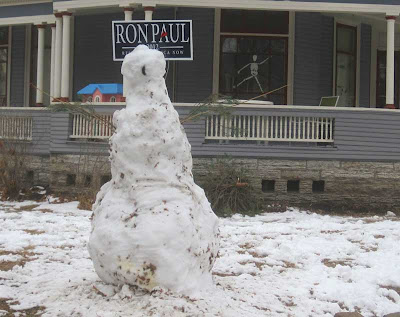 8 foot tall snow man with Ron Paul campaign sign bisecting its head