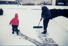 Violet and Tammy shovel snow