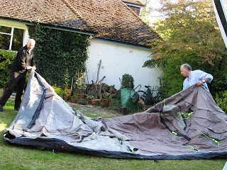 The tent laid out flat on the lawn