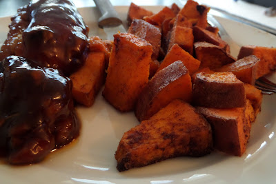 Bite-sized chunks of sweet potato tossed in coconut oil, cumin, and cinnamon.  Then baked until crispy and soft.