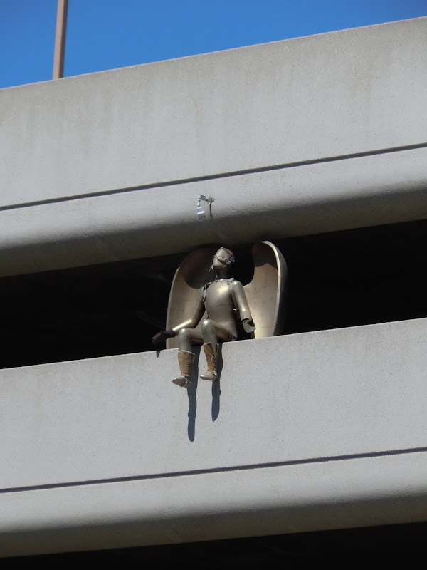 Sitting angel sculpture San Vicente Blvd