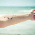 Flying birds tattoo on arm 
