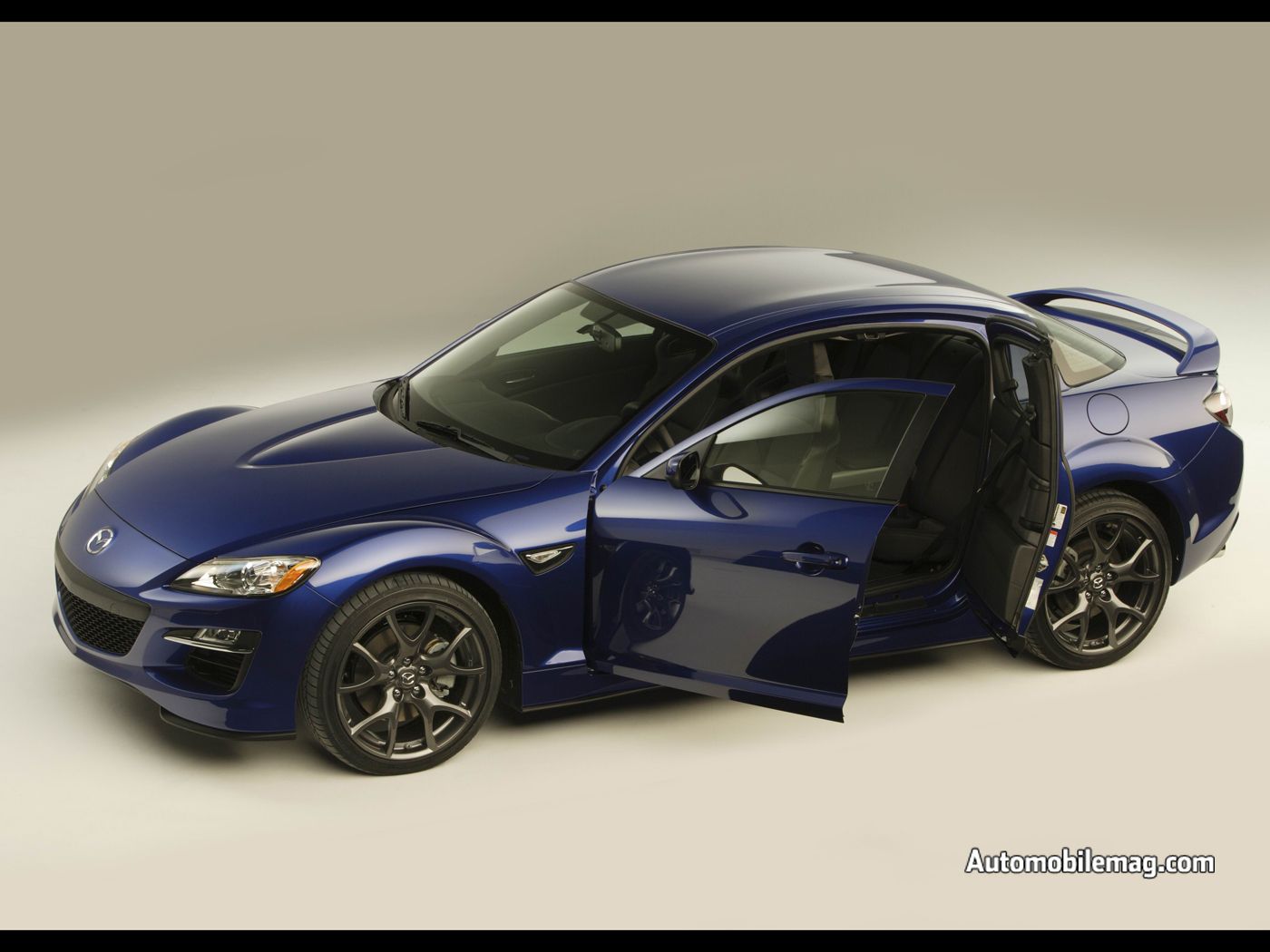 http://2.bp.blogspot.com/-sbe5dMm4P0I/TyF9pWbX2vI/AAAAAAAABDk/PYtZ7fvnX-I/s1600/0801_11_c+2009_mazda_rX-8+front_three_quarter_view1.jpg